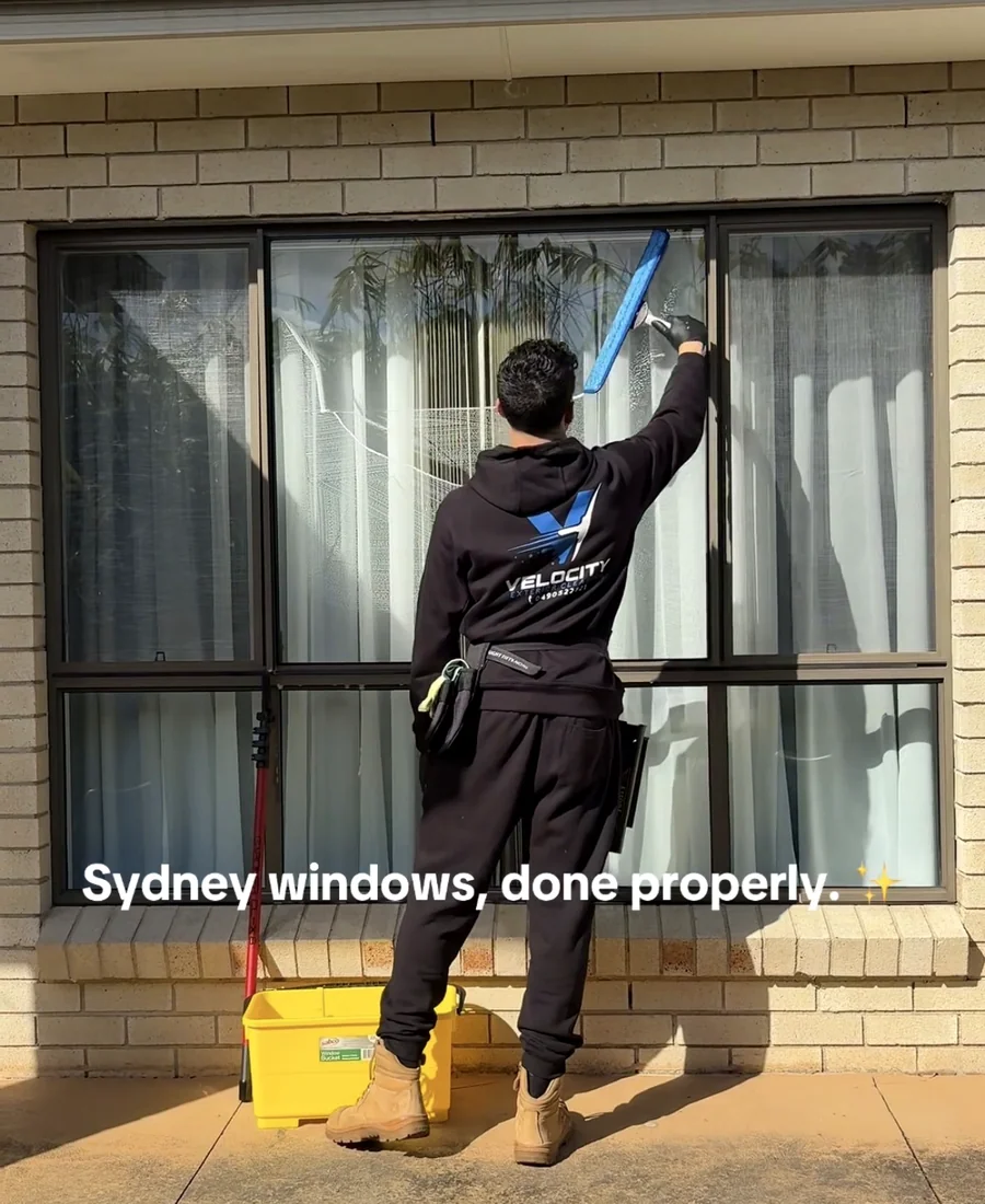 Velocity Exterior Cleaning cleaning a residential window